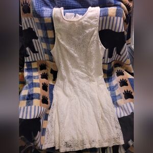 Speechless white lace dress with bow in back and pockets. Size L